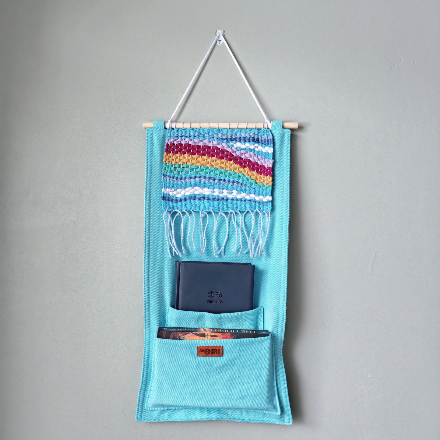 KÄTKÖ Rainbow Handwoven Wall Pocket – Nordic Textile Wall Hanging with Storage