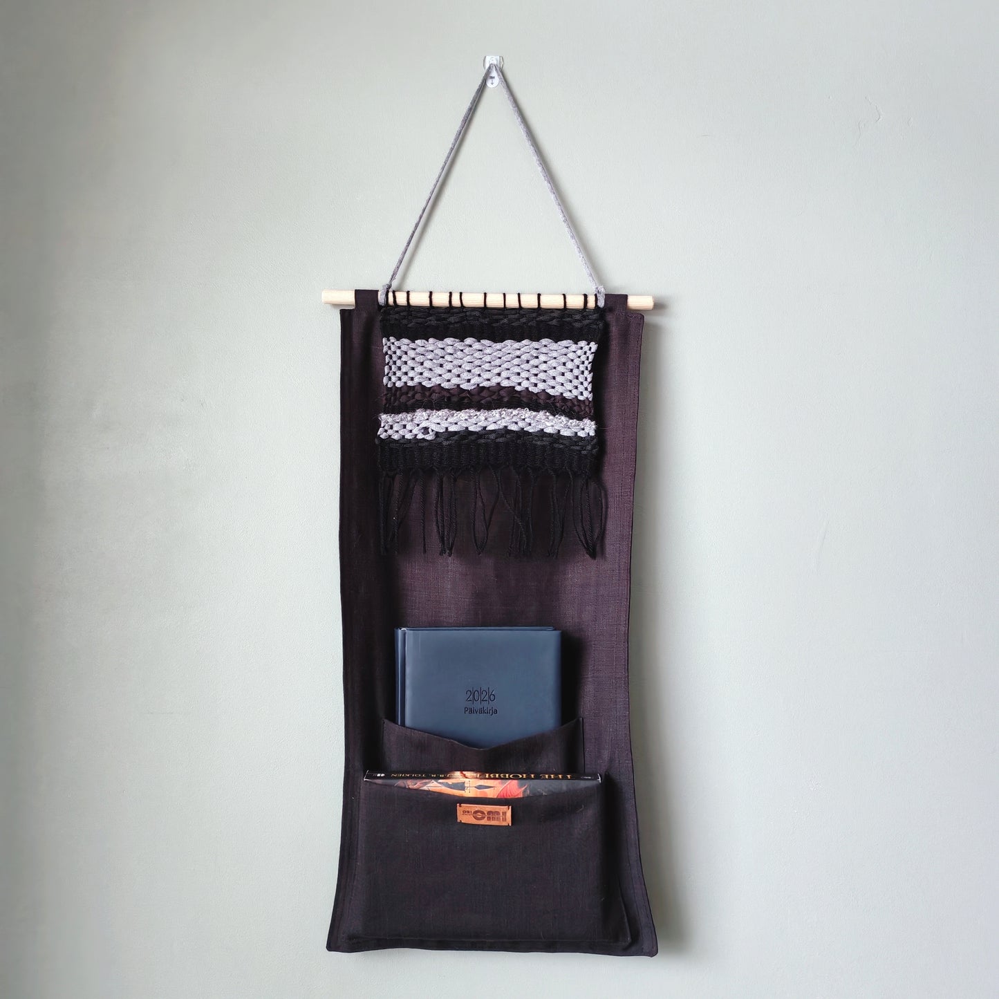 KÄTKÖ Darkness Handwoven Wall Pocket – Nordic Textile Wall Hanging with Storage